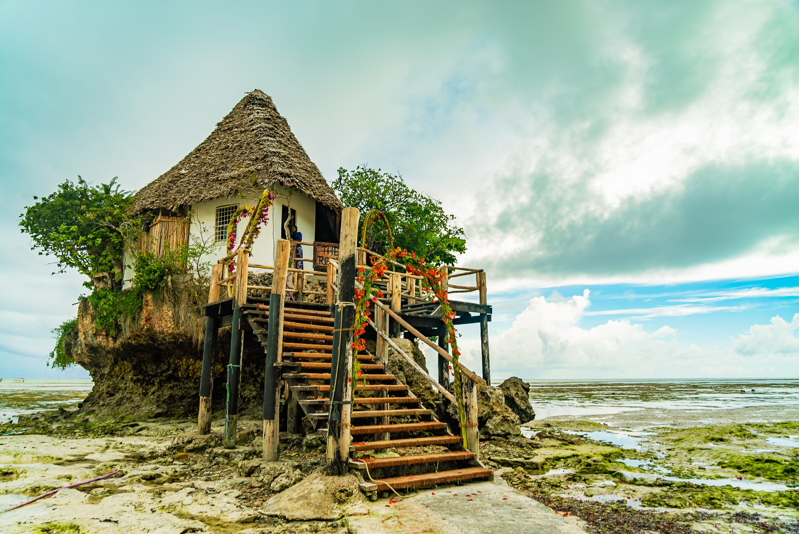 The Rocks restaurant on the beach during low tide. Pingwe, Zanzibar, Tanzania.